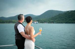 Happy moments of interracial couples on a yacht The couple had their honeymoon at one of Asia's photo