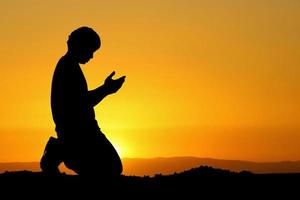 man praying for blessings from god. A lonely, heartbroken, unemployed and hopeless man. photo