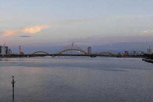 The Dragon Bridge in Da Nang at dusk photo