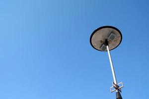 LED Spotlight Pole with Blue Sky Background. photo