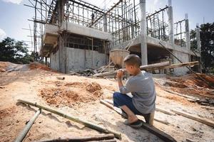 Poor children are forced to work construction, Violence children and trafficking concept,Anti-child labor, Rights Day on December 10. photo
