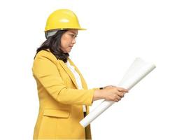 Engineer holding yellow helmet with blueprint isolated on white background with clipping path. photo