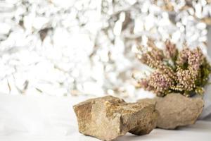 A gentle background for the presentation. Stones and small pink flower buds. Stylish appearance, layout, personality. Banner, a place for text. photo