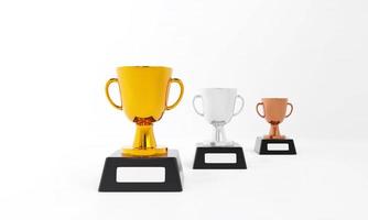 trofeos para los ganadores. conjunto de trofeos de oro, plata y bronce sobre fondo blanco. concepto ganador, diseño de premios, logro, 1°, 2°, 3° lugar. ilustración de renderizado 3d foto