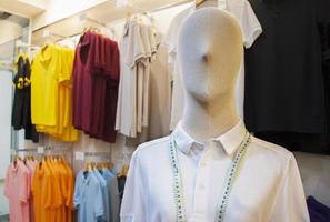 Mannequin with white shirt in clothing store photo