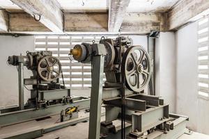 Two elevator motor in elevator engine room photo