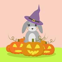 a rabbit in a witch's hat sits surrounded by pumpkins vector