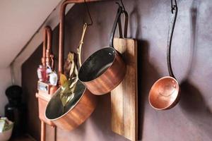 kitchenware and household utensils on kitchen shelves photo
