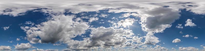 blue sky with beautiful clouds as seamless hdri 360 panorama view with zenith for use in 3d graphics or game development as sky dome or edit drone shot photo