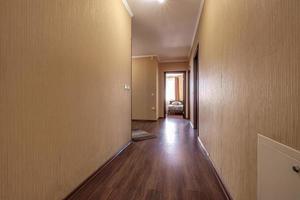 long empty corridor in interior of entrance hall of modern apartments photo