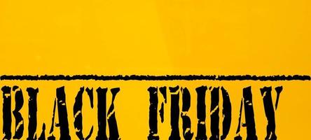 Black friday with yellow background,Black friday rustic wooden background, big black letters, sales promotion photo