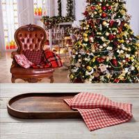 Pizza board, with napkin on wooden table. Top view mockup. Festive sparkling Christmas interiors background photo