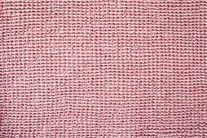 Smooth pink rough fabric texture top viev photo