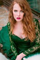 redhead beautiful young girl in long green dress photo