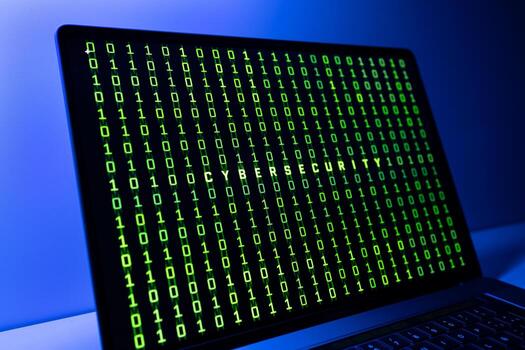 Cybersecurity concept. Laptop screen with cibersecurity word and binary code background photo