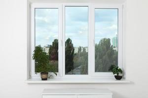 Window in an empty new apartment without curtains photo