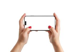 Woman hands holding phone in horizontal position. Isolated screen for playing games mobile mockup photo