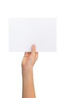 Hand holding blank flyer, sheet of paper in horizontal position with isolated background photo