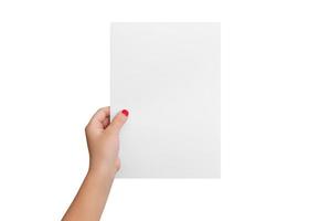 Isolated girl's hand hold a blank paper in a vertical position. Copy presentation mockup photo