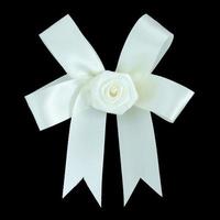 White satin gift bow. Ribbon. Isolated on black with clipping path photo