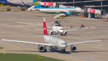 SOCHI, RUSSIA JULY 29, 2022 - Airbus A330 of Nordwind on the airfield at Sochi airport. Tourism and air travel concept video