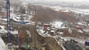 NOVOSIBIRSK, RUSSIAN FEDERATION MARCH 14, 2021 - Aerial, big construction site working, time lapse video