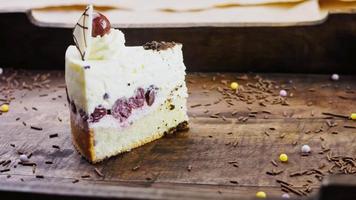 Delicious cherry cake on a wooden tray with decorations video