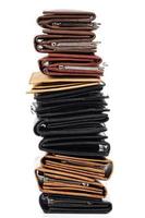 Stack of different wallets on white background photo