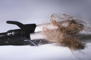 Hair curler tool and clump of hair photo