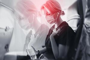 Woman feeling sick with motion sickness because of turbulence in airplane photo
