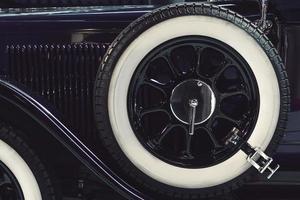 Spare wheel of the classic retro car photo