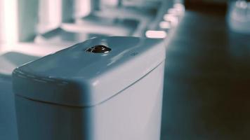 Rotating washbasin. Studio filming. In the background a row of toilets. 4k video