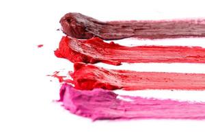 Different multi colored samples of a smudged lipstick photo