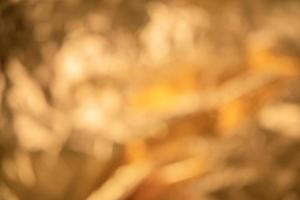 Abstract out of focus golden metallic background photo