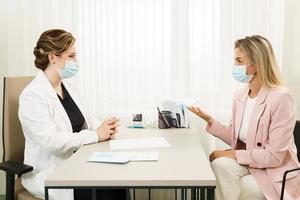 Doctor talking to patient photo