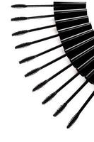 A lot of black Mascara wands on white background photo