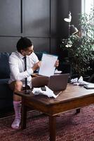 Businessman without pants working from home. Concept of distant work during quarantine photo