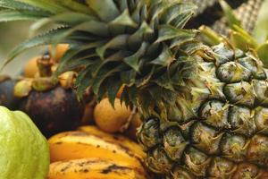 Close up background of different tropical fruits photo