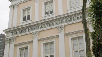 view of the old parliament building of singapore city with colonial architecture design building with overcast sky video