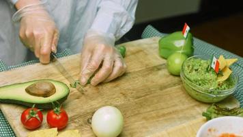 Cut a green and hot pepper into small slices. Macro shooting video