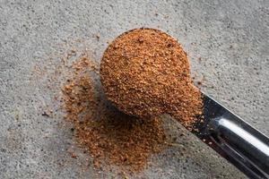 Ground Nutmeg Spilled from a Teaspoon photo