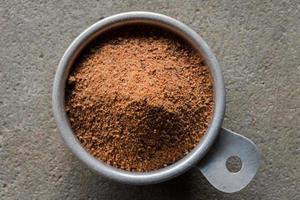 Ground Nutmeg in a Bowl photo