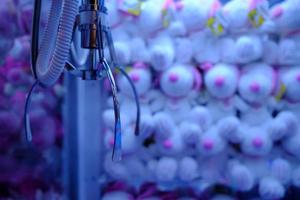 Toy Crane Claw Machine in Selective Focus. photo