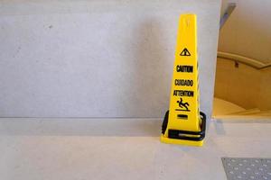 Yellow Caution Pole for Slippery Floor. photo