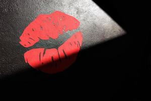 Red lips painted on the wall. Horizontal image. photo