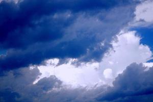 Blurred background. Blue sky and white fluffy clouds. photo