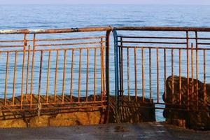 Security fence on the Mediterranean coast. photo