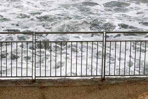 Security fence on the Mediterranean coast. photo