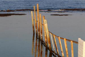 Security fence on the Mediterranean coast. photo