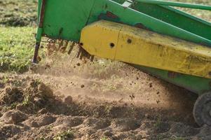 A mechanized method of harvesting potatoes in the village. photo